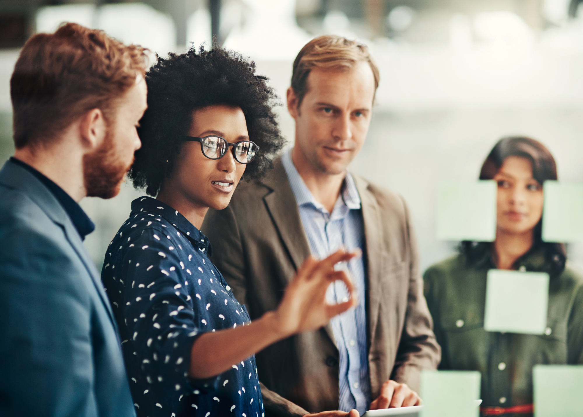 Group of people sharing ideas during a meeting